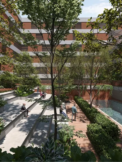 The heart of the community project is this sunken courtyard with stepped seating. It acts as a natural amphitheater and gathering spot, seamlessly integrated with trees and gardens.