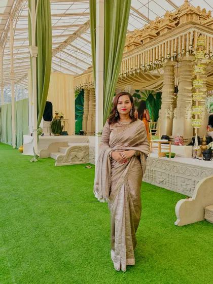 The client at an event in her custom beige tissue silk saree.