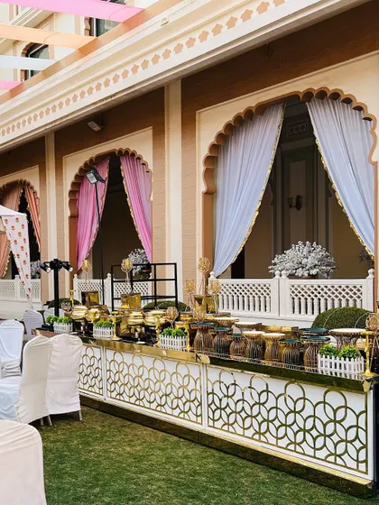 For this event at a classic venue, I designed a buffet that complemented the traditional architecture. The ornate gold and white counters and classic serveware blend seamlessly with the elegant surroundings.
