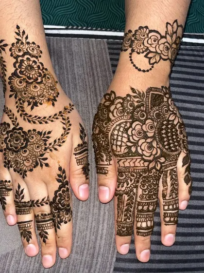A unique, asymmetrical design where one hand has a traditional floral vine and the other features a more modern, bracelet-style pattern. This is perfect for clients who want something different.