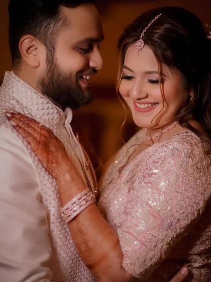 An intimate close-up of the engaged couple, their happy smiles and gentle embrace capturing the warmth and love of the moment.