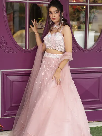A full-length shot of the pink lehenga, perfect for a sangeet or engagement party.