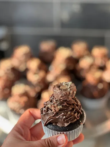 A close-up of my Ferrero Nutella Cupcake. It's a moist chocolate cupcake with a ganache center, topped with Nutella mousse and a Ferrero Rocher.