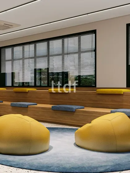 This versatile hall in an institutional project is designed for both recreational activities and quiet relaxation. With flexible design elements like tiered seating and comfortable beanbags, it offers an environment that encourages engagement and caters to the diverse needs of students.