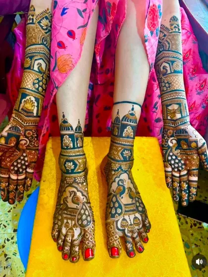 A vibrant and stunning full bridal set. The dark stain of the organic henna stands out beautifully, with coordinated peacock and architectural designs on both hands and feet.