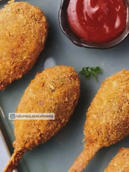 Crispy Veg Lollipops, a fun and tasty appetizer perfect for parties. These breaded and deep-fried vegetable balls are served on a stick with ketchup, making them a hit with both kids and adults.