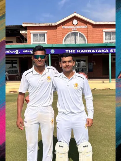 Two of our academy players standing proudly in front of the Karnataka State Cricket Association building, a place they have earned the right to call home.