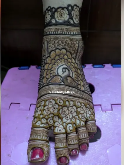 A single foot adorned with a beautiful peacock and floral design. This is a great option for someone who wants an intricate but not overwhelming look.