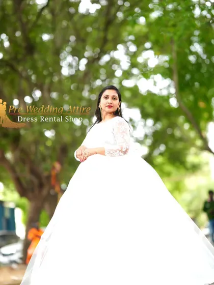 A more formal portrait in the white ball gown, showing its elegant and timeless appeal.