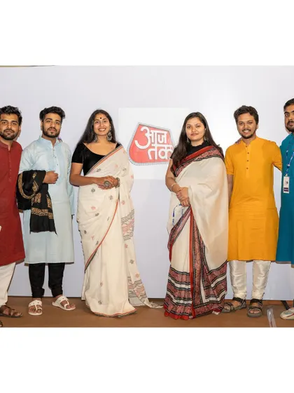 A group photo with the team and organizers at the AajTak event.