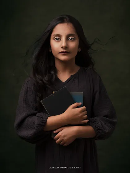 A similar pose from the same session, this portrait captures a quiet and thoughtful moment. The painterly style is perfect for creating timeless kids' portraits.