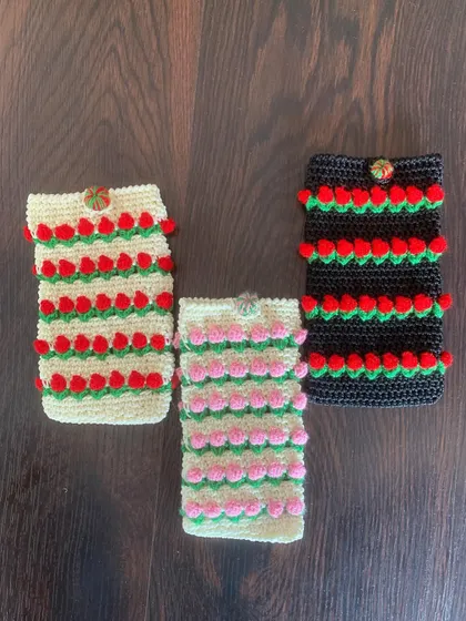 A look at all three color variations of my tulip mobile pouches together: cream with red, cream with pink, and black with red.