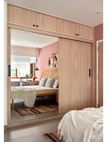 The wardrobe in the second guest bedroom, finished in a beautiful oak laminate with a large mirror on one sliding shutter to make the room feel much larger.