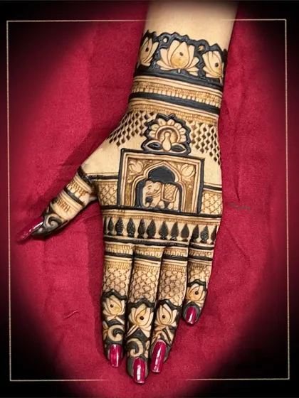 A classic design featuring an elephant in a decorated frame, surrounded by lotus motifs. This is a timeless choice for any festive occasion.