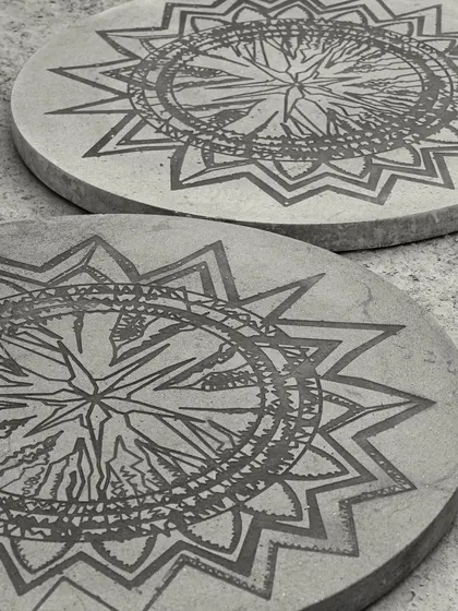 Our Concrete Art Table, featuring beautiful, intricate artwork etched directly onto the concrete tabletop. This piece is for those who want their furniture to tell a unique story.