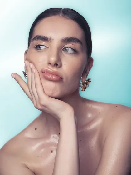 A playful shot that still highlights the beautiful, dewy skin and natural-looking makeup.
