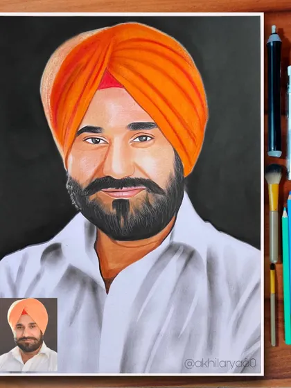 A strong portrait of a man in a turban, created on A3 paper with colored pencils. The bright orange of the turban contrasts sharply with the black background, making it a very striking piece.
