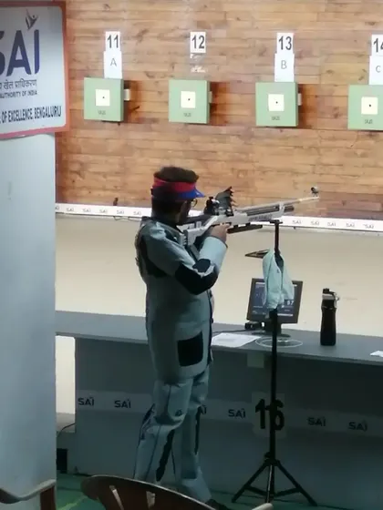 A shooter at the Sports Authority of India (SAI) range during a competition, putting his training into practice.