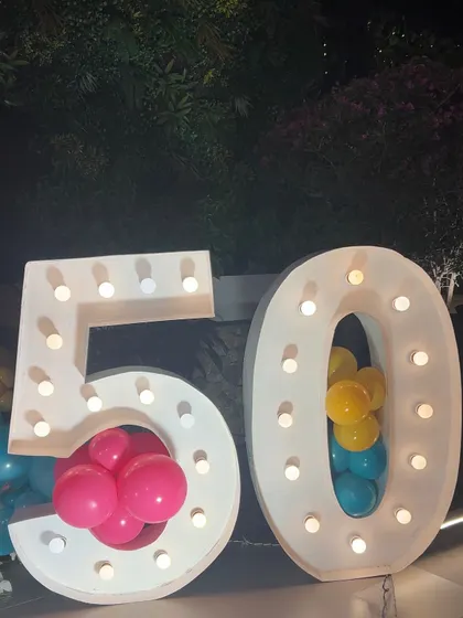 Our marquee numbers can be filled with balloons that match your party's color scheme, adding another layer of customization.