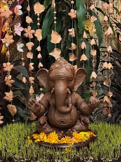 Our studio's own handcrafted Ganesha, beautifully decorated with clay ornaments, fruits, and flowers. This is the kind of festive, natural beauty we aim for.
