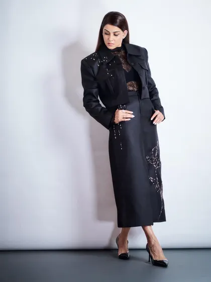 The complete look for Genelia. The embellished jacket and matching midi skirt create a cohesive and incredibly chic ensemble, perfect for any high-profile event.