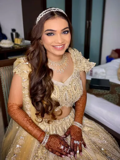 The smile says it all! This bride is glowing and ready for her sangeet, with a makeup look that is both glamorous and elegant.
