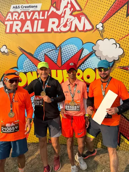 Four of our runners with their medals after the Aravali Trail Run. The pride is evident.