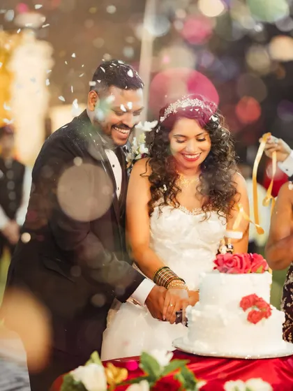 A joyful moment during the cake cutting. Janice's kinky curls were styled to perfection and held up beautifully throughout the entire celebration.