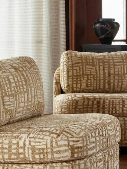 A close-up of the "Montana" slipper chair's upholstery, revealing the intricate, textured pattern of the fabric. This detail shot underscores our commitment to using high-quality, visually interesting textiles in our custom furniture pieces.