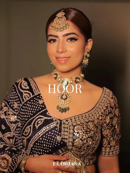 For this campaign with Faabiiana, I styled a traditional bandhani lehenga. The deep blue fabric with intricate gold work is paired with a classic polki and emerald set, creating a timeless and regal look.