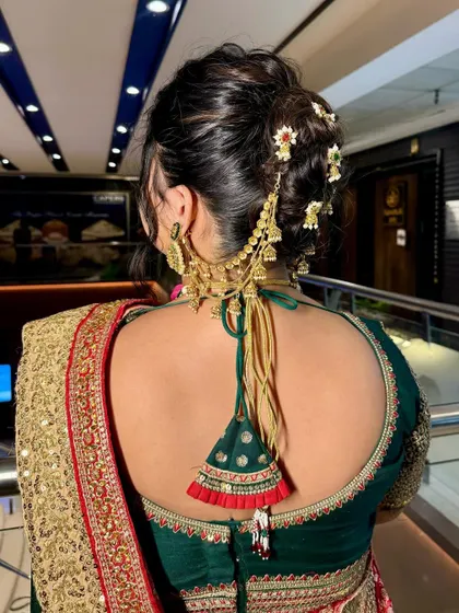 A view of the intricate bridal bun and hair accessories. A complete bridal look includes beautiful hairstyling, which I coordinate to match the makeup and outfit.