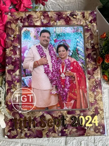 A full view of the anniversary frame. Even after 25 years, the flowers can be preserved to create something this special. It's a testament to enduring love.