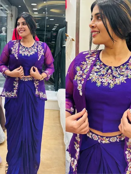 A beautiful purple Indo-Western outfit with a drape skirt and a hand-embroidered organza jacket.