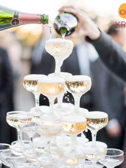 A champagne tower adds a touch of celebration and grandeur to any event. We can arrange and manage beverage services like this to create unforgettable moments for your guests.