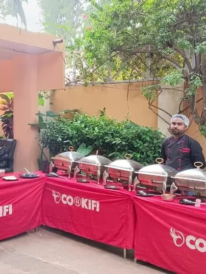 A buffet setup in a pleasant outdoor setting for a corporate lunch with Hector Beverages, the makers of Paperboat.