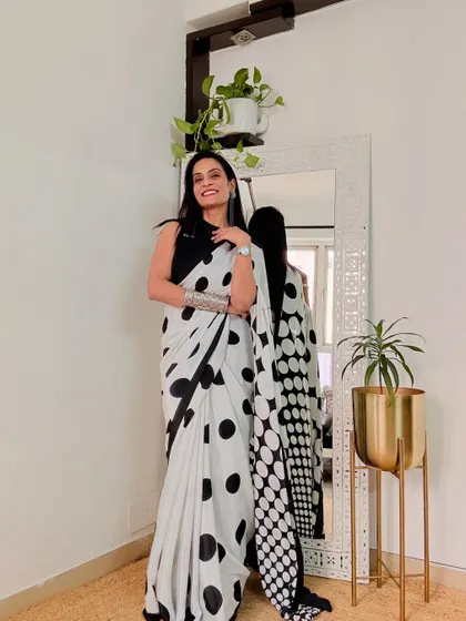 This black and white polka dot saree is a fun, retro-inspired piece. It's a crepe saree that is very chic and can be styled for a modern, playful look.