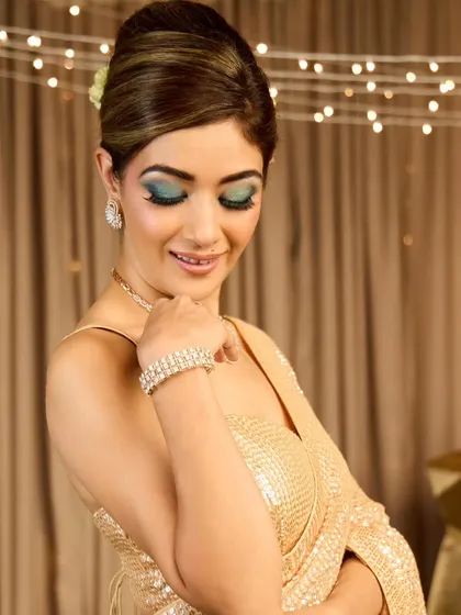 A close-up of the French roll, showing the clean lines and volume at the crown. This is a classic hairstyle that exudes elegance.