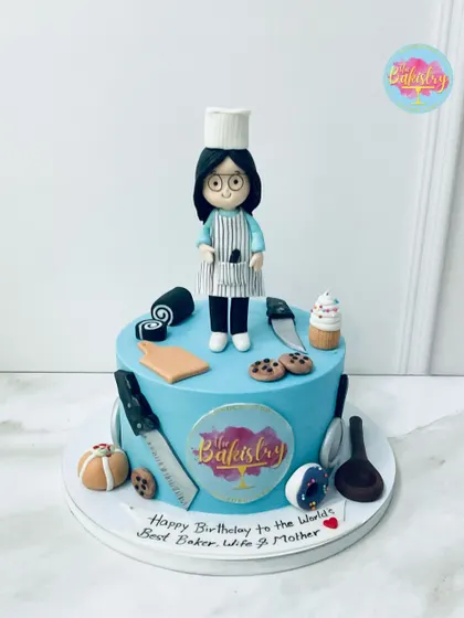 A sweet tribute to the world’s best baker, wife, and mother! This adorable chef-themed cake is a celebration of her passion, complete with tiny baking tools and a custom topper.