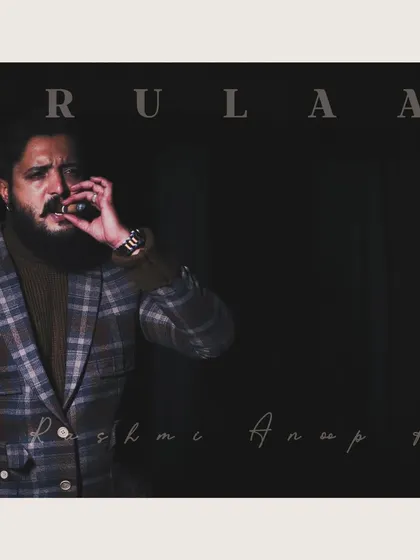 For this look, we went for a moody, powerful vibe. This custom-tailored plaid blazer is paired with a turtleneck for a sophisticated, modern aesthetic.