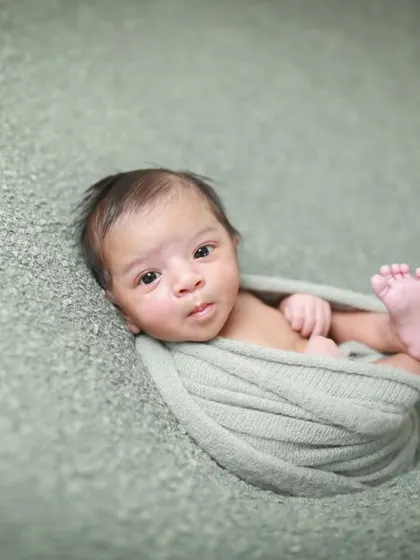 Those tiny feet and that little stretch. Sometimes the most beautiful poses are the ones they find all on their own. A precious, unposed moment.