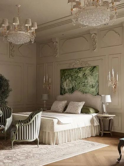 A traditional and timeless look is achieved in this bedroom with ornate wall mouldings and classic striped armchairs. The abstract green artwork above the bed adds a fresh, contemporary touch to the otherwise classical design.