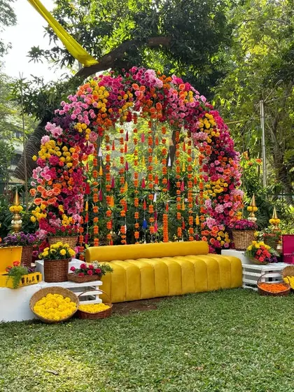 The full view of the colorful Mehendi seating area, designed to be a vibrant and joyful space for the ceremony.