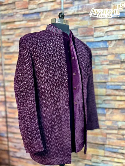 The rich texture of velvet defines this wine-colored Jodhpuri suit. Its deep color and sequin work on the collar and jacket create a regal and luxurious feel, perfect for making a lasting impression at an evening function.