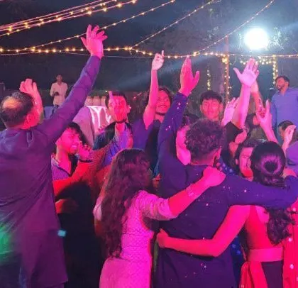 A moment of togetherness on the dance floor at the community Diwali event.