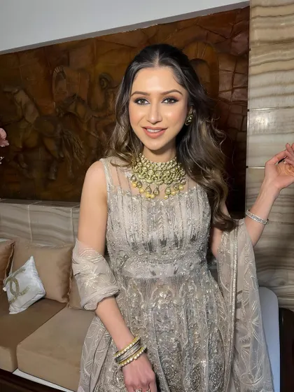 A close-up portrait, her smile and glowing skin stealing the show.