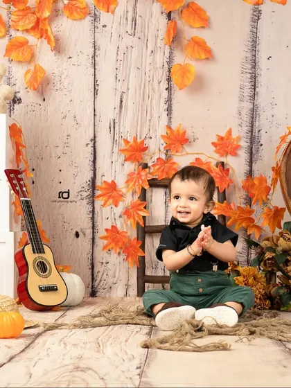 A happy, clapping moment from our autumn-themed first birthday shoot.