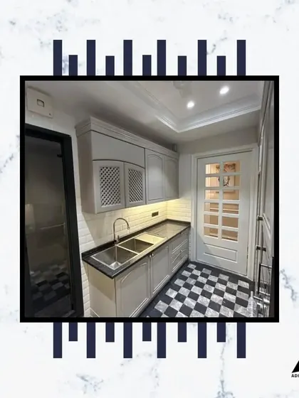 Another view of this beautifully designed kitchen, showing the latticed cabinet doors and the seamless integration of the sink and countertop. It's a perfect blend of classic and modern.
