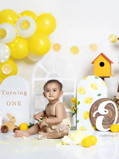 The aftermath of a successful cake smash! We believe the mess is part of the memory, capturing pure toddler joy.