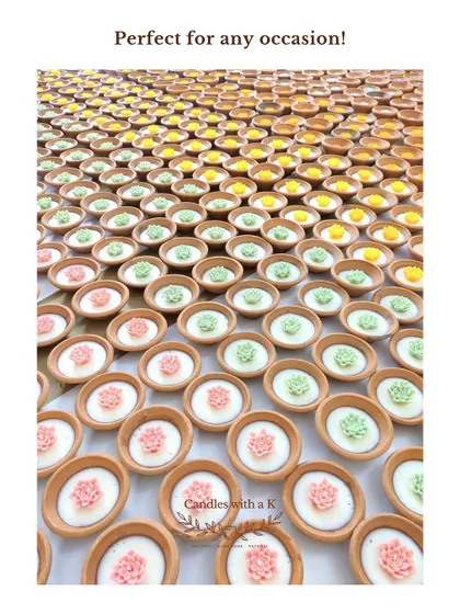 A massive floor display of hundreds of clay pot candles, showing the scale of my production and their suitability for any occasion.