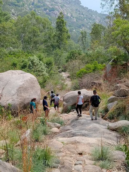 The crew navigating a beautiful, boulder-strewn path at Bidarakatte. This is a great example of the kind of beginner friendly trails we explore.